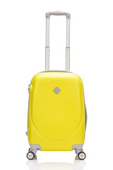 front view of yellow plastic wheeled colorful suitcase with handle isolated on white