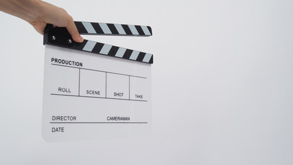 Hands is holding Clapperboard or movie slate. it use in video production ,film, cinema industry on...