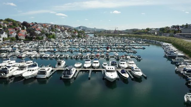 Amazing Cinematic Long Duration Aerial of Marina With Boats and Yachts and Typical Scandinavian Nordic Houses on Coastline