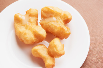 A plate of delicious deep fried dough stick
