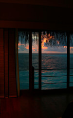 Maldives sunset, view from the hotel room on the water