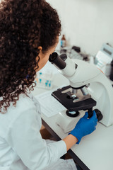 Intelligent female biologist working on her project