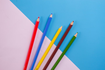 colorful pencils on blue background