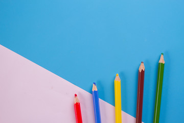 colorful pencils on blue background