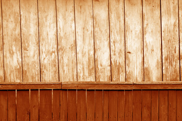 Old grunge wooden fence and wooden wall pattern in orange tone.