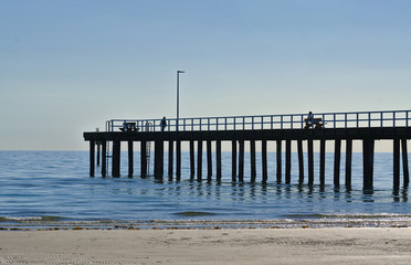 Fototapeta premium Distant view of beach pier in afternoon