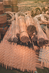 Materials and equipment of thai OTOP product from dry Catathea grass weave as basketry.