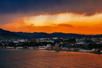 beautiful sunset and the city by the sea