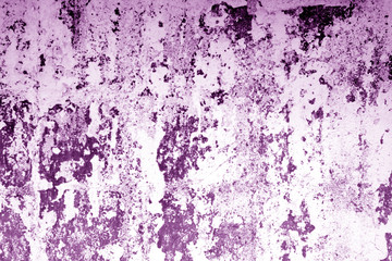 Сraked weathered cement wall texture in purple tone.