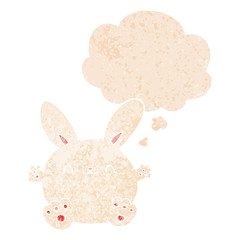cute cartoon rabbit and thought bubble in retro textured style