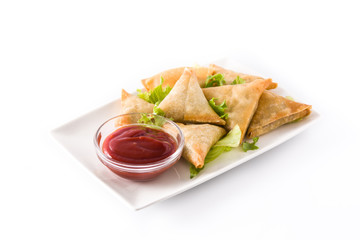 Samsa or samosas with meat and vegetables isolated on white background . Traditional Indian food.