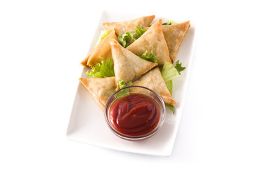Samsa or samosas with meat and vegetables isolated on white background . Traditional Indian food.