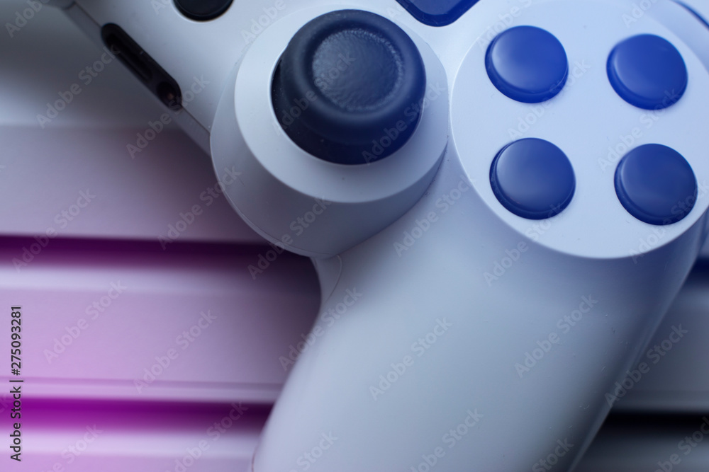 Poster game controller and game console in special light. macro. concept view. close up.