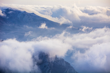 Fototapeta na wymiar Clouds and rocks. Mountain range Demerdzhi