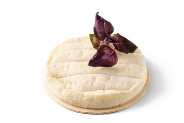 Obraz na płótnie Canvas Soft cheese and basil isolated on white background