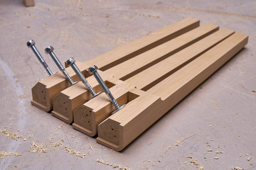 Solid wood table legs building process. Wooden furniture manufacturing process. Furniture...