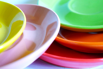 background with abstract shapes and colors of pink and green dishes