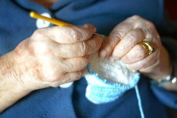grandmother's hands knit blue baby booties
