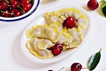 Pierogi aka vareniki with cherry and butter