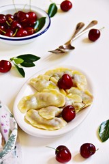 Pierogi aka vareniki with cherry and butter