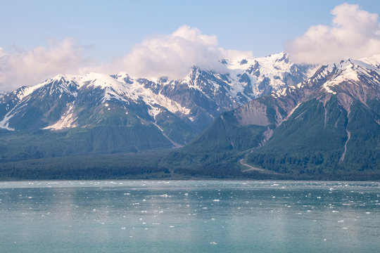 Majestic mountains tower over icy Glacier Bay in Alaska
