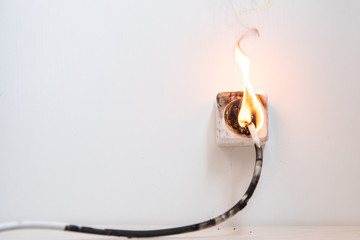 Electrical short circuit. Failure caused by burning wire and rosettes socket plug in house