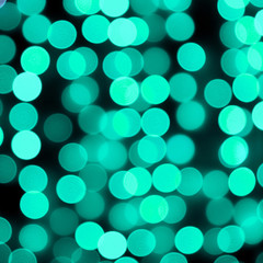 Unfocused abstract colourful bokeh black background. defocused and blurred many round blue light