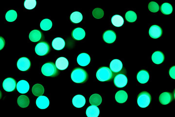 Unfocused abstract colourful bokeh black background. defocused and blurred many round blue light