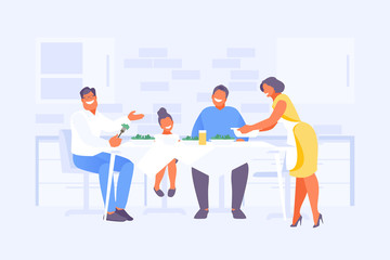 Family in the kitchen at the table