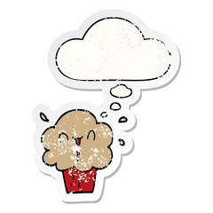 cartoon cupcake and thought bubble as a distressed worn sticker