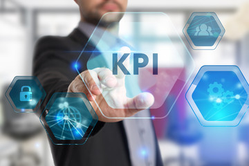 The concept of business, technology, the Internet and the network. A young entrepreneur working on a virtual screen of the future and sees the inscription: KPI