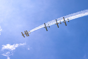 Airplanes on airshow. Aerobatic team performs flight at air show in Krakow, Poland.
