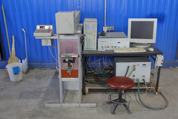 Vintage inspector workplace at production factory with old desktop computer