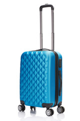 blue wheeled textured suitcase with handle isolated on white