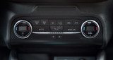 panel on car dashboard with controls for air conditioning