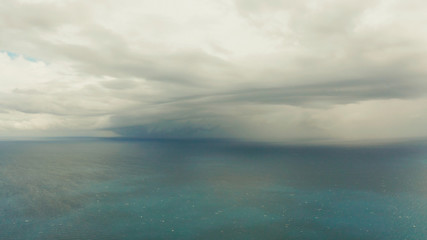 Obraz premium Seascape in cloudy weather, aerial view. Stormy weather over the ocean. Copy space for text. Water cloud horizon background.