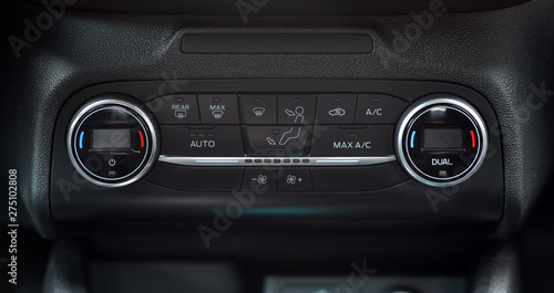 panel on car dashboard with controls for air conditioning