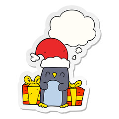 cute christmas penguin and thought bubble as a printed sticker