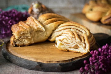 A piece of sweet braided bun on a beautiful background.