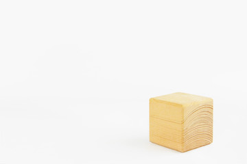 wooden decorative cube with patterns of divorces on white background