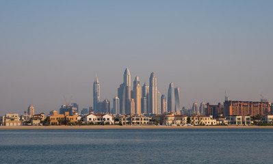 DUBAI, UAE - may 2019. View of various skyscrapers including Cayan Tower in Dubai Marina with stunning turquoise waters as foreground