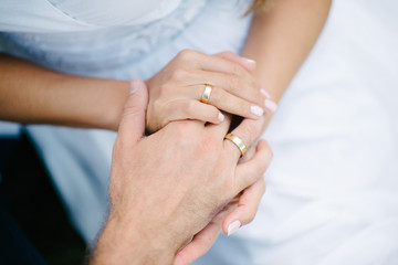 Man and woman hold hands close up