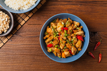 Chicken kung pao. Fried chicken pieces with peanuts and peppers.