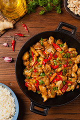 Chicken kung pao. Fried chicken pieces with peanuts and peppers.