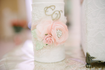Big white wedding cake with fruit is on the table