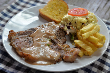 T-Bone Steak with Vegetable Salad and French Fries