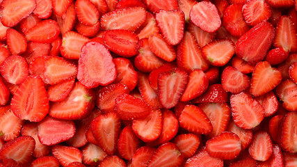 Strawberry slices. Fresh berries macro. Fruit background. Top view.