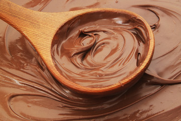 Chocolate spread with wooden spoon