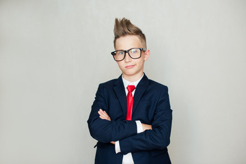 Image of handsome businessman in glasses with arms crossed on chest