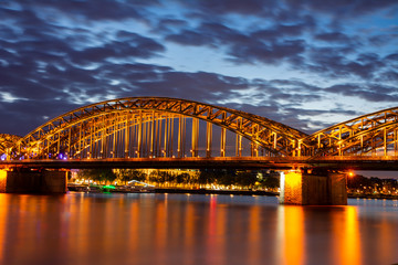 Fototapeta na wymiar Illuminated Hohenzollern Bridge in Cologne